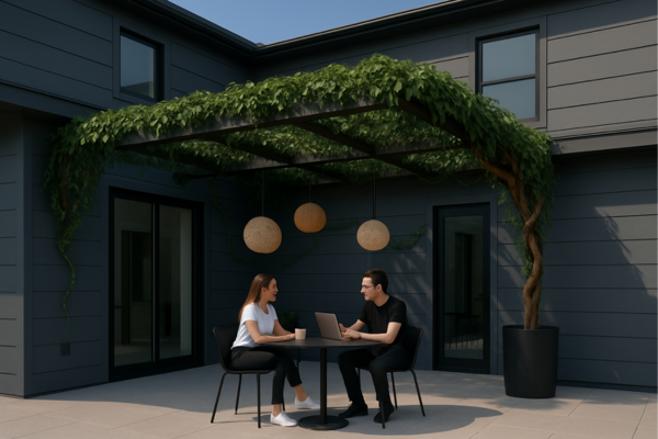 A couple sitting at a table with artificial trellis overhead